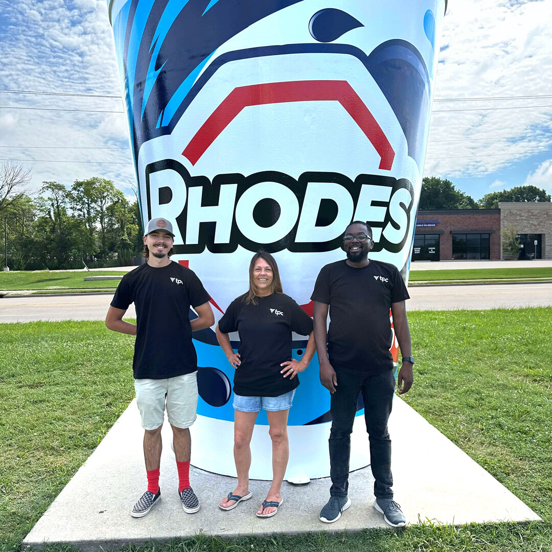tpc team in front of the Rhodes World Record Fountain Drink Cup