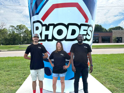 tpc team in front of the Rhodes World Record Fountain Drink Cup