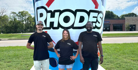 tpc team in front of the Rhodes World Record Fountain Drink Cup