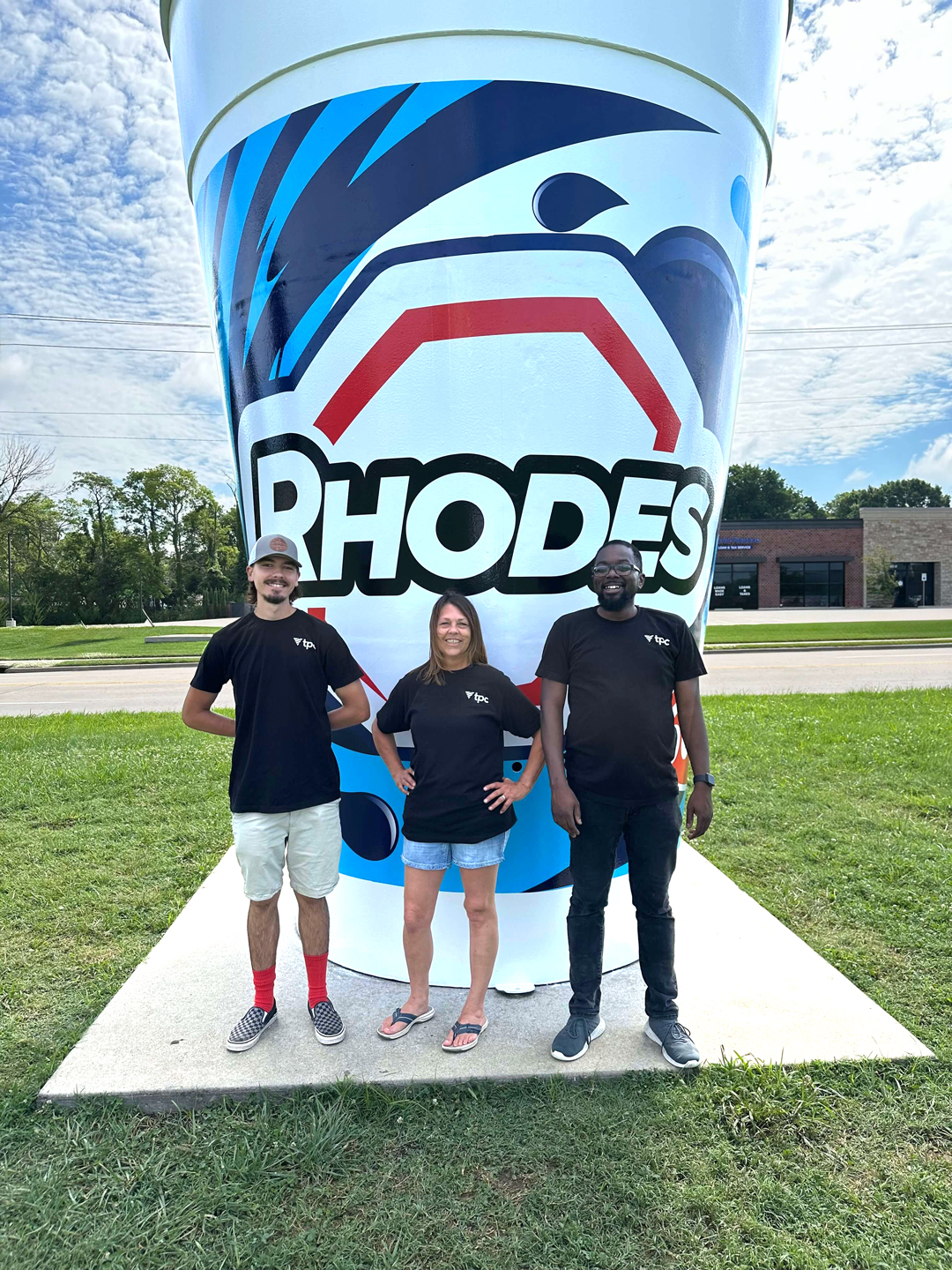 tpc team in front of the Rhodes World Record Fountain Drink Cup