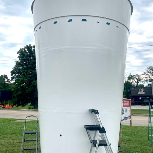 The 13 ft tall Rhodes cup before the rewrap, showing a white base coat.